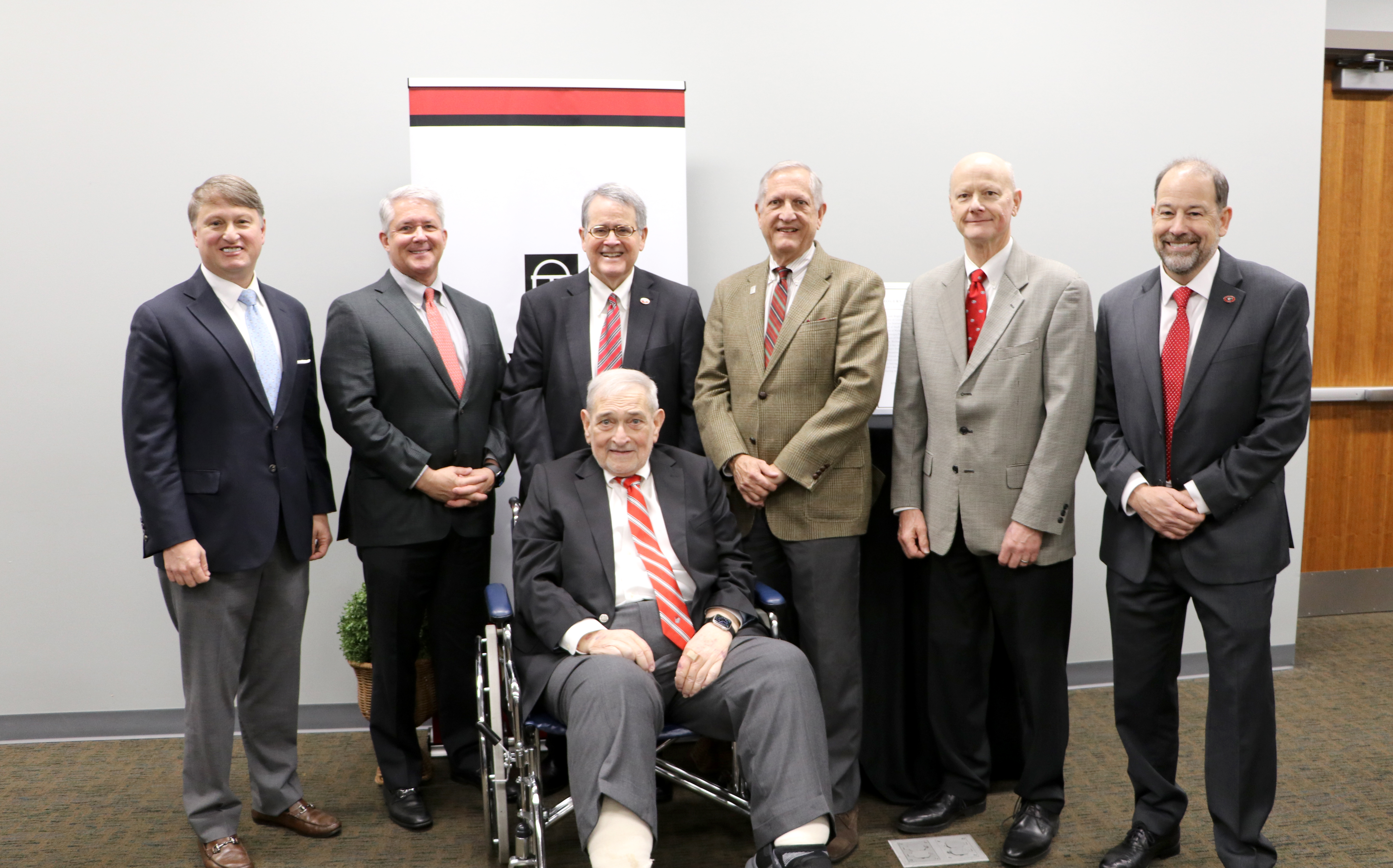 Members of the Richard B. Russell Foundation Board of Trustees congratulate emeritus member T. Rogers Wade (first row, center) on being named the 2025 recipient of the Dooley Friends of the UGA Libraries Award. Pictured from left to right are: Pat Wilson, commissioner of the Georgia Department of Economic Development; John “Jay” Neely III; UGA President Jere W. Morehead; C. Randall Nuckolls; Steve Wrigley, former chancellor of the University System of Georgia; and Toby Graham, UGA associate provost and university librarian. (Photo by Camie Williams)