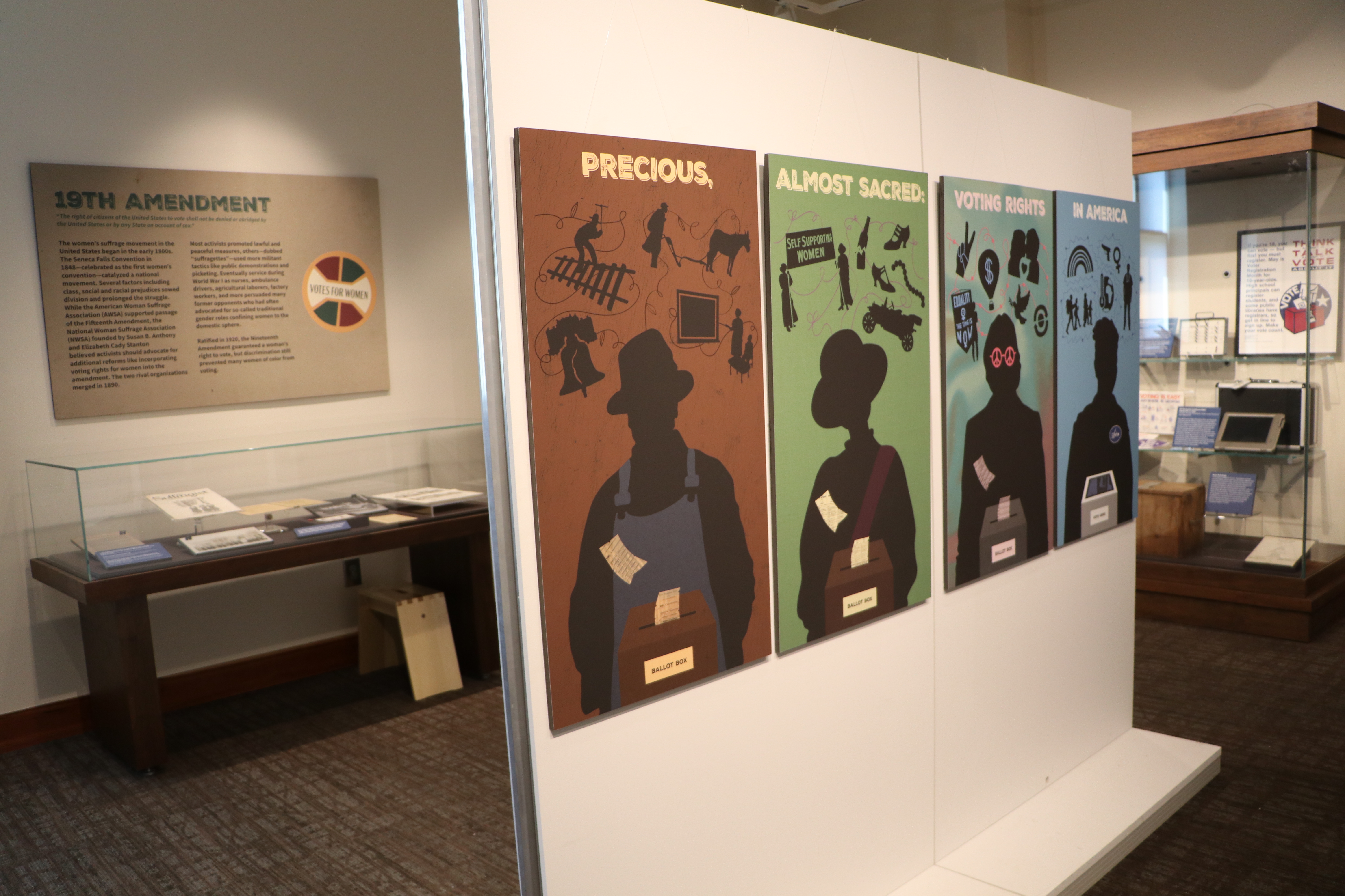 Photo of museum exhibit with sign "Precious, Almost Sacred: Voting Rights in America"