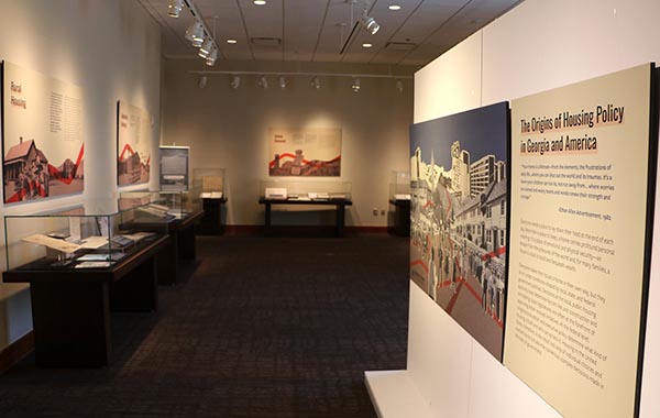 Photo of the exhibition, showing panels and exhibit cases