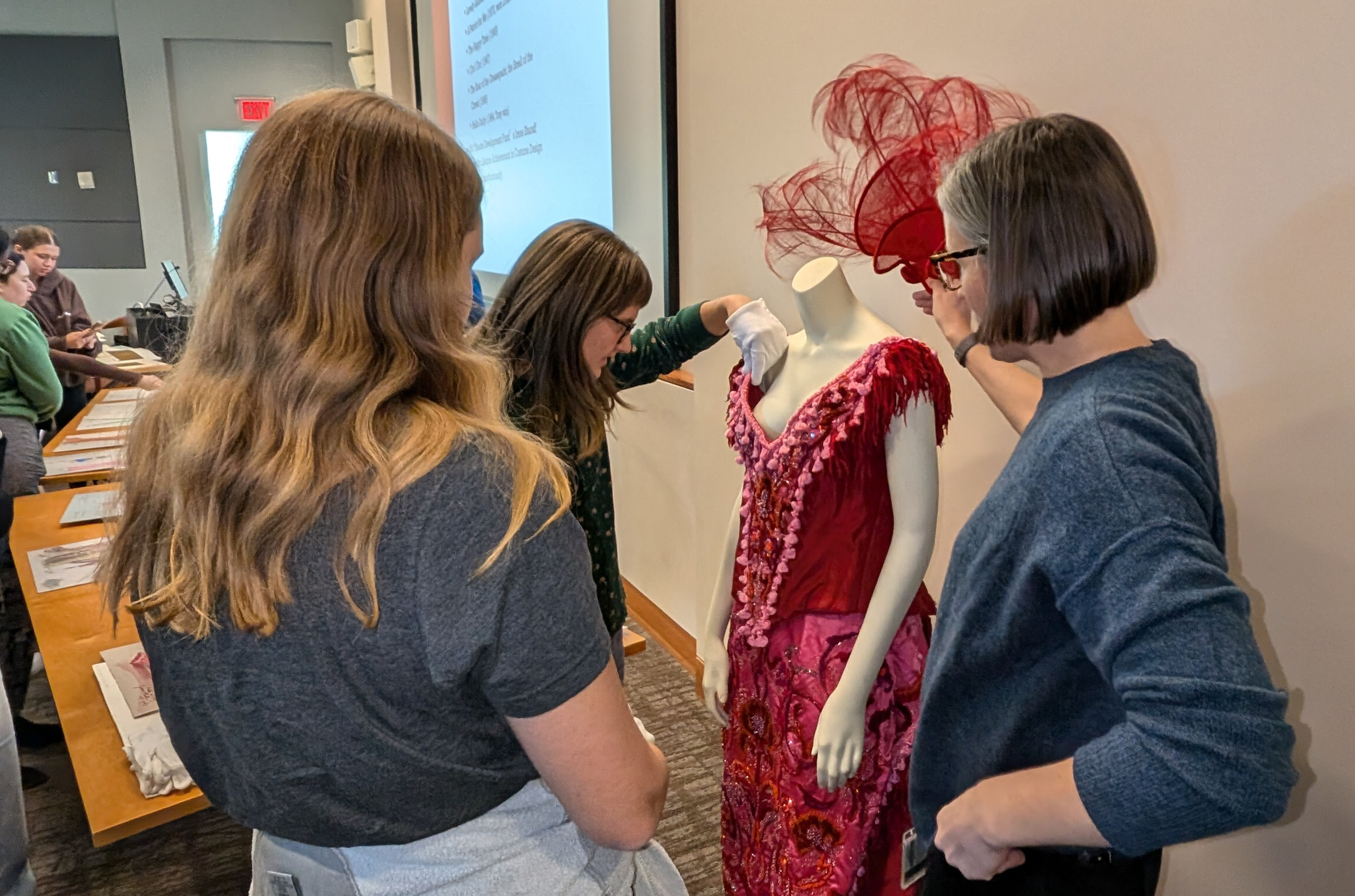 Student looks at costume design