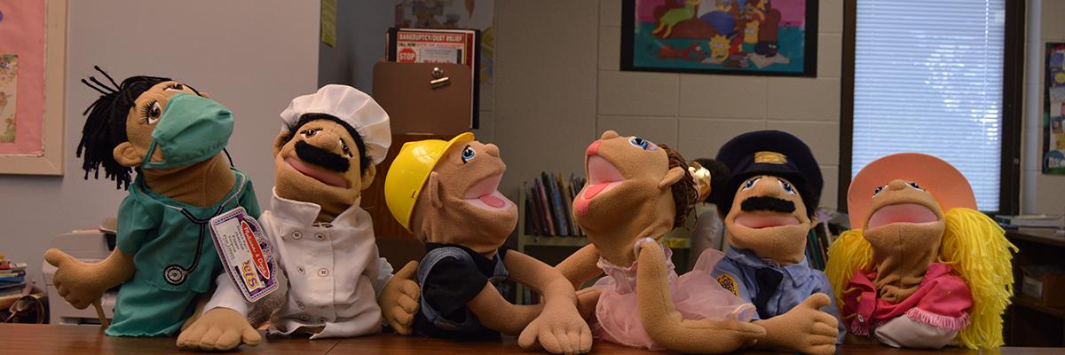 Six of our Muppet puppets performing in the Curriculum Materials Library