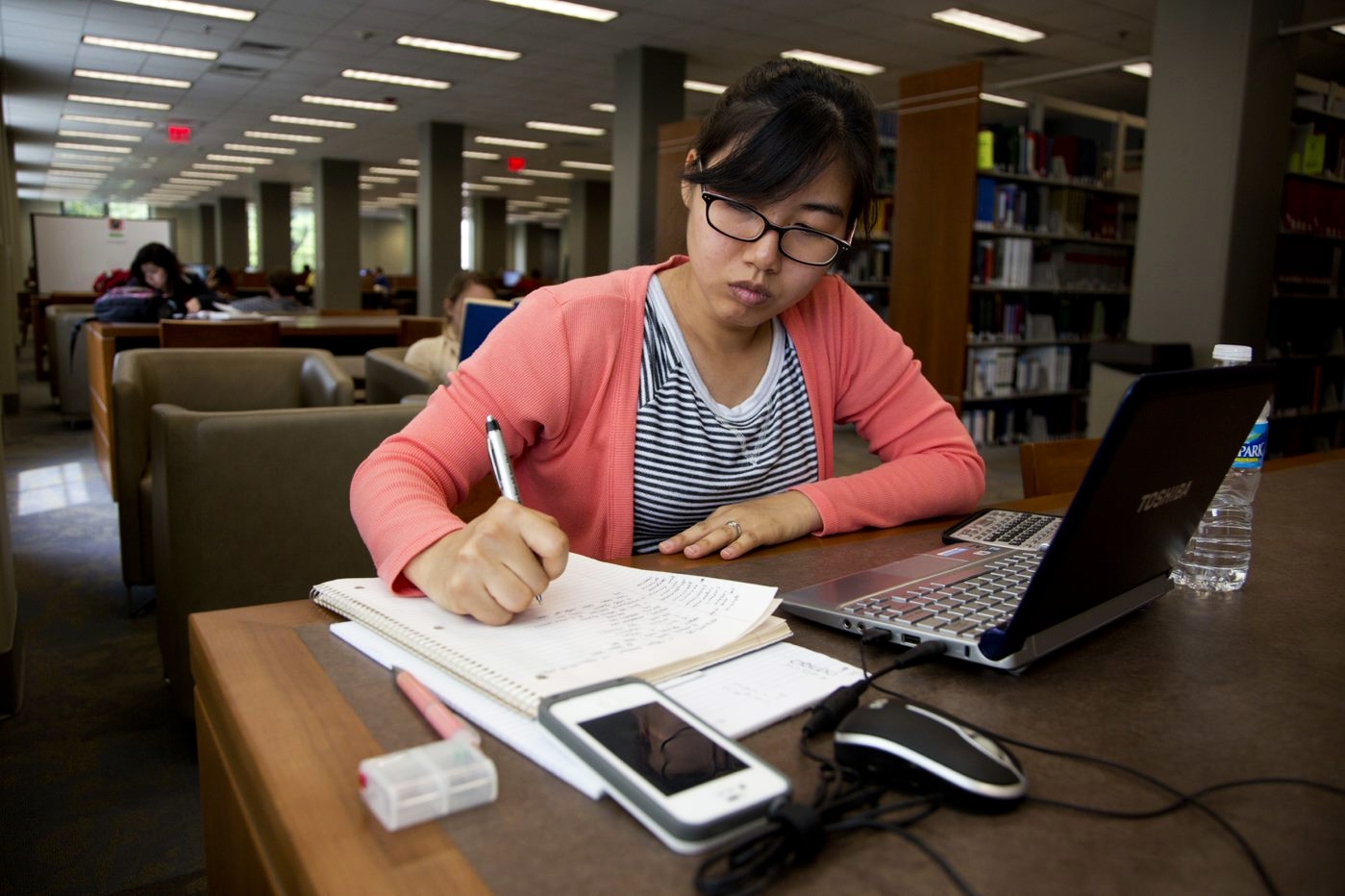 female student studying in Main Library