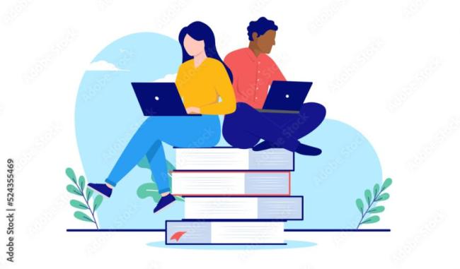 two students studying on top of a pile of books with laptops