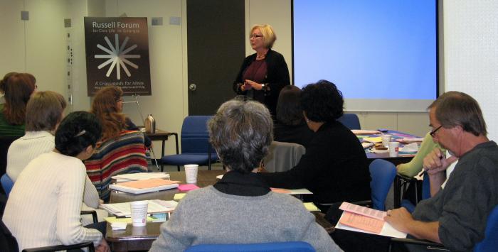 Dr. Margaret Holt leads a deliberative dialog training session at the Russell Library. 